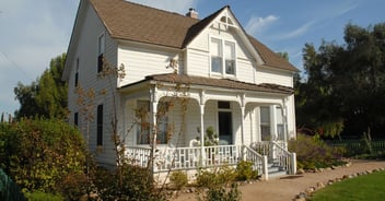 Victorian-style home in Jackson, TN with decorative gables and wraparound porch