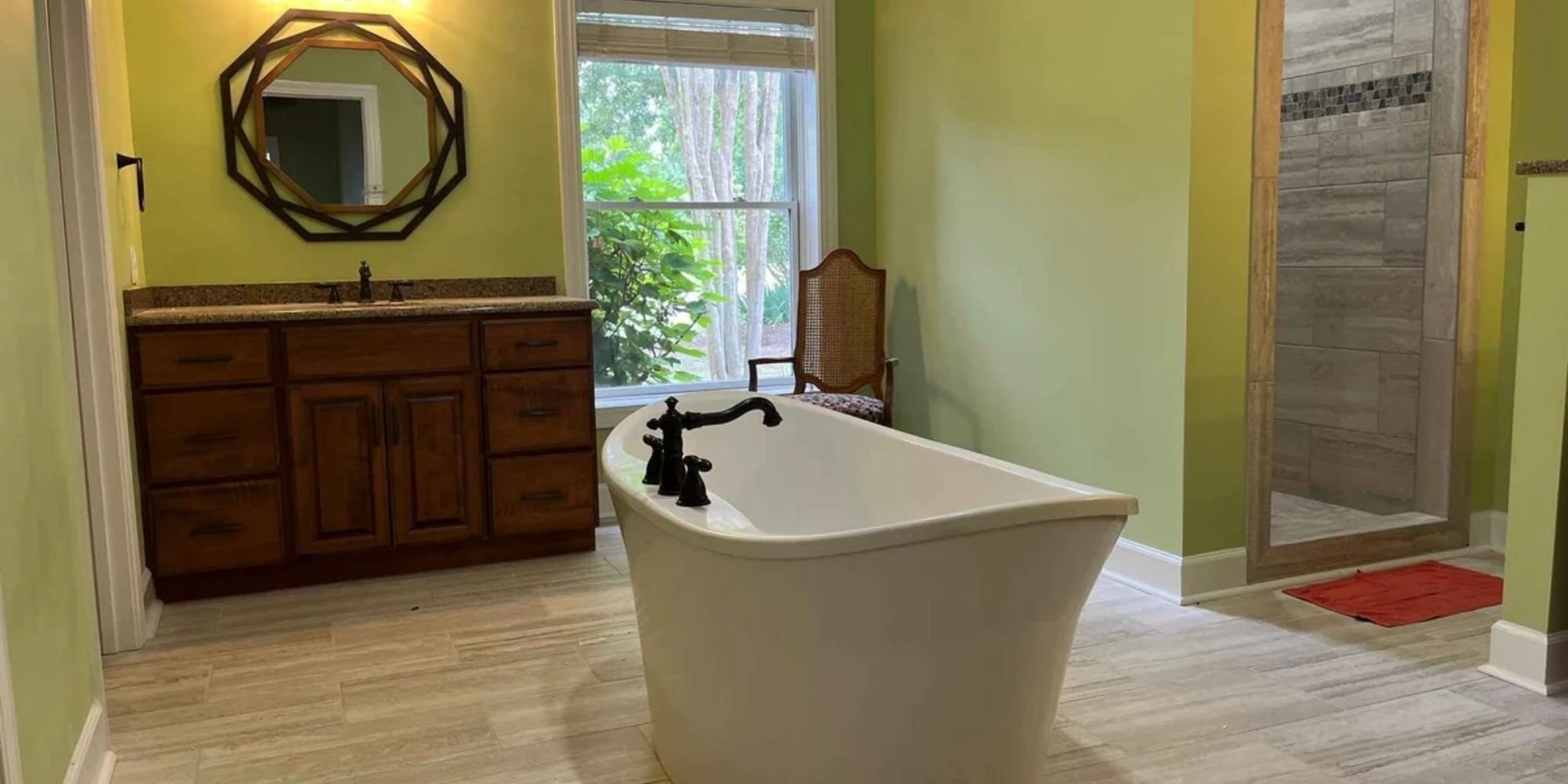 Freestanding tub and walk-in tile shower in a Wolfe Construction bathroom remodel in Jackson, TN