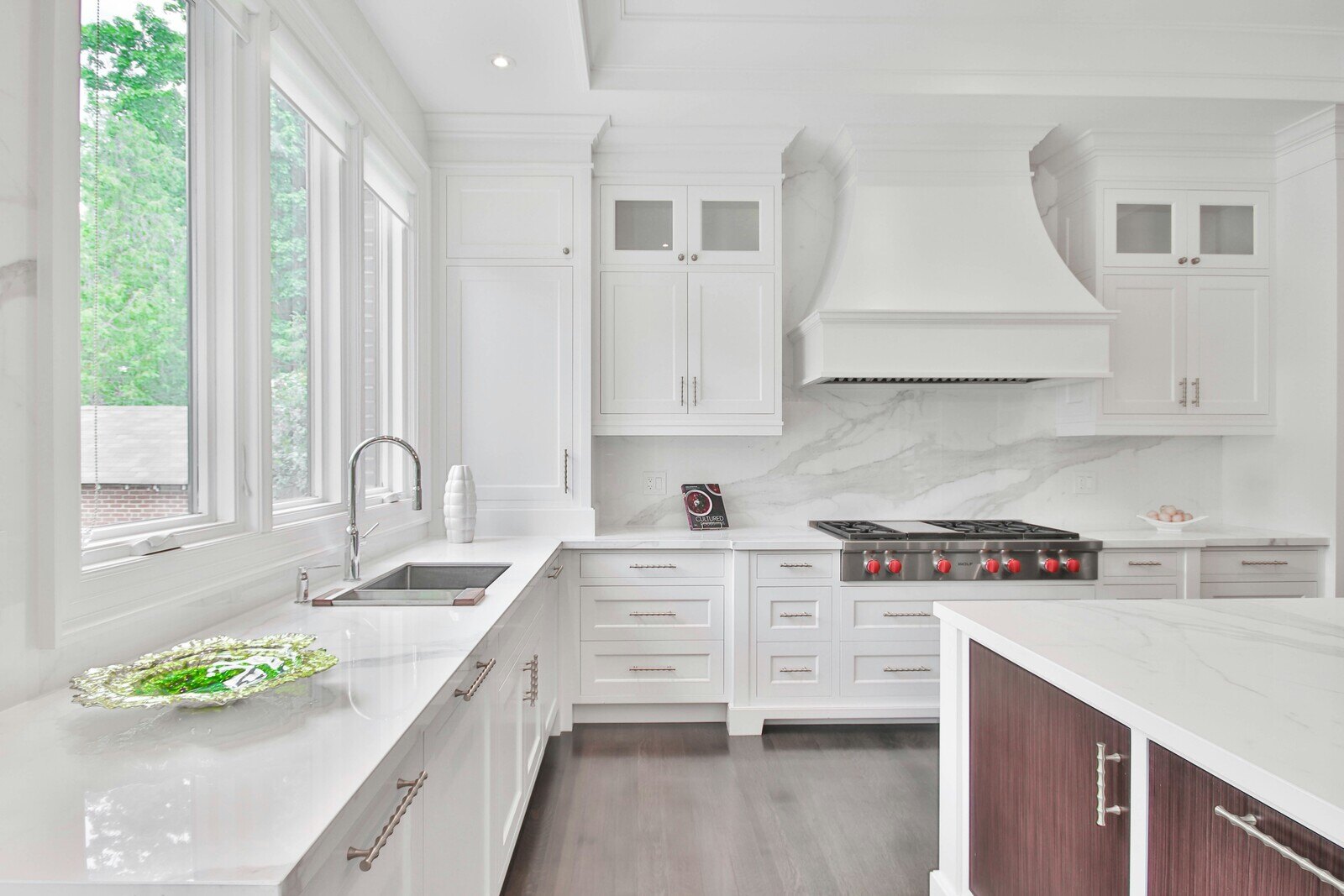 West Tennessee-Kitchen Remodeling- Wolfe Construction Co.-Bright and spacious white kitchen with marble countertops and custom cabinetry by Wolfe Construction in Jackson, TN